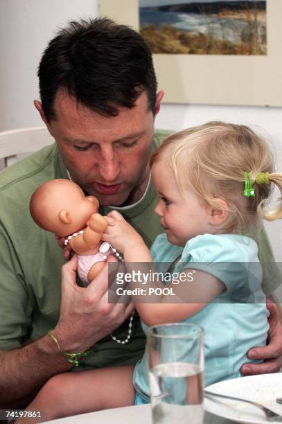 British Gerry McCann plays with his daughter Amelie in their appartment in Praia da Luz in Portugal 19 May 2007. Madeleine McCann vanished from a...