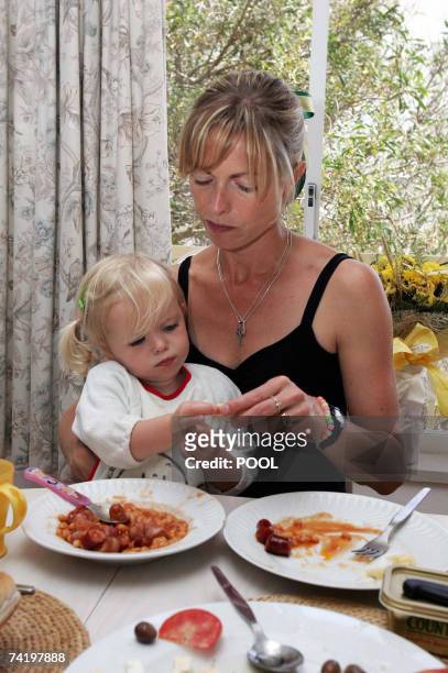 British Kate McCann has breakfast with her daughter Amelie in their appartment in Praia da Luz in Portugal 19 May 2007. Madeleine McCann vanished...