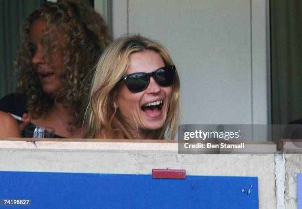 Model Kate Moss laughs as she attends the Music Industry Soccer Six event at Upton Park on May 20, 2007 in London, England.