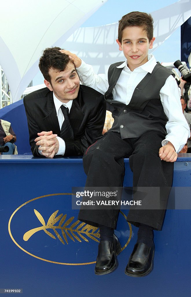 Israeli actor Yonathan Alster (R) and fe...