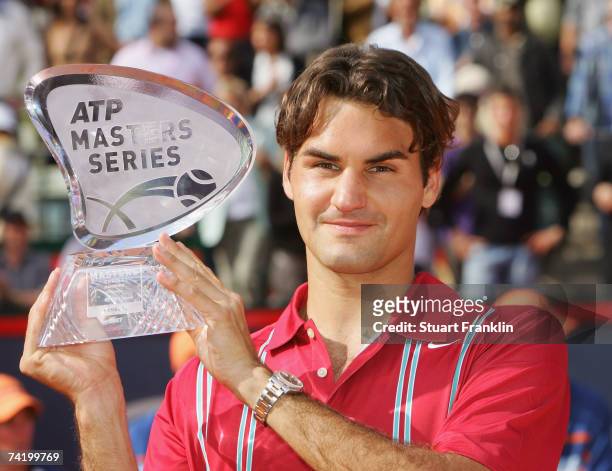 Roger Federer of Switzerland with the trophy after winning the final match against Rafael Nadal of Spain during day seven of the Tennis Masters...