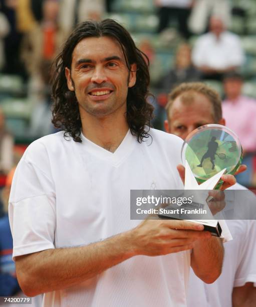 Sergi Bruguera of Spain poses with his trophy after defeating Thomas Muster of Austria during BlackRock Tennis Classic 2007 at Rothenbaum Tennis...