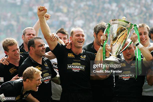 Captain Lawrence Dallaglio of London Wasps celebrates with his team mates after winning the Heineken Cup Final between Leicester Tigers and London...