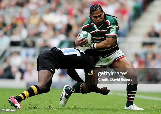 Alesana Tuilagi of Leicester Tigers is tackled Paul Sackey of London Wasps during the Heineken Cup Final between Leicester Tigers and London Wasps at...