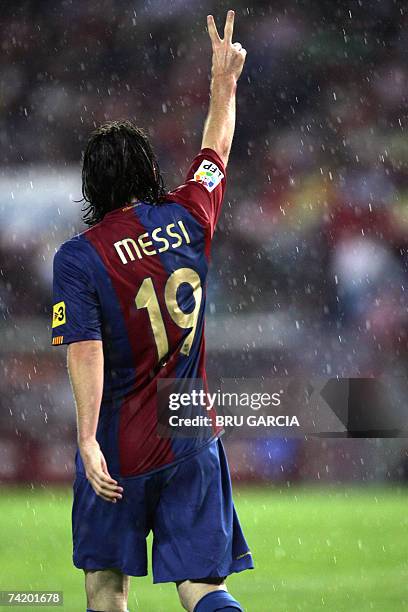 Barcelona?s Messi gives the victory sign after scoring the first goal during a Spanish league football match against Atletico de Madrid, 20 May 2007,...