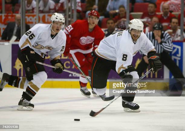 Teemu Selanne of the Anaheim Ducks skates with the puck ahead of teammate Samuel Pahlsson against the Detroit Red Wings in game five of the 2007...