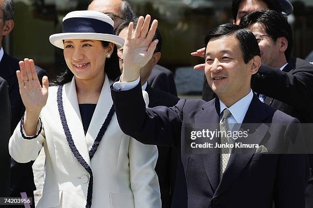 Crown Prince Naruhito and Crown Princess Masako wave as Emperor Akihito and Empress Michiko depart for Europe at Tokyo International Airport May 21,...