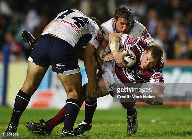 Glen Hall of the Eagles is tackled during the round 10 NRL match between the Manly Warringah Sea Eagles and the Brisbane Broncos at Brookvale Oval...