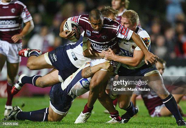 Nick Bradley-Qualilawa of the Eagles is tackled during the round 10 NRL match between the Manly Warringah Sea Eagles and the Brisbane Broncos at...