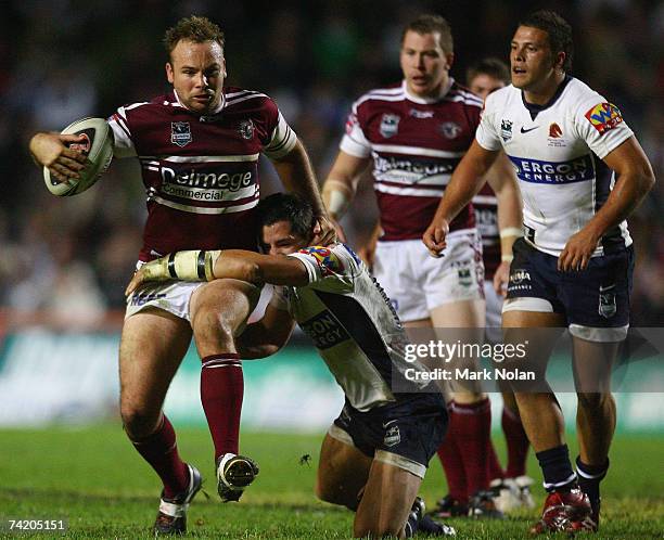 Glenn Stewart of the Eagles is tackled during the round 10 NRL match between the Manly Warringah Sea Eagles and the Brisbane Broncos at Brookvale...