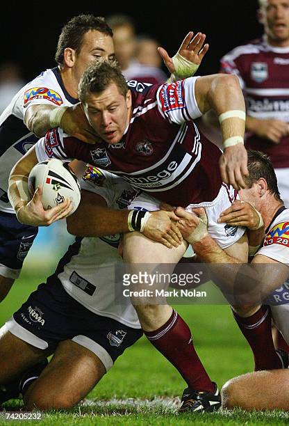 Glen Hall of the Eagles looks to offload during the round 10 NRL match between the Manly Warringah Sea Eagles and the Brisbane Broncos at Brookvale...