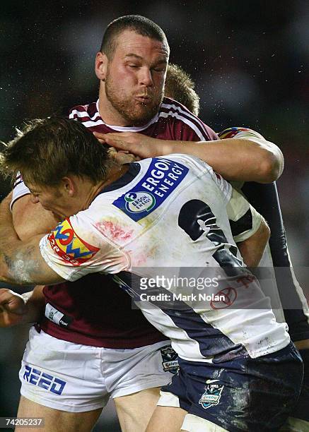 Jason King of the Eagles is tackled during the round 10 NRL match between the Manly Warringah Sea Eagles and the Brisbane Broncos at Brookvale Oval...