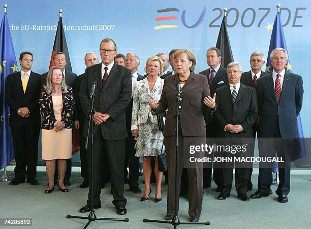 Former Daimler Chrysler CEO and now chairman of the Southern Africa Investment Initiative Juergen Schrempp and German Chancellor Angela Merkel...