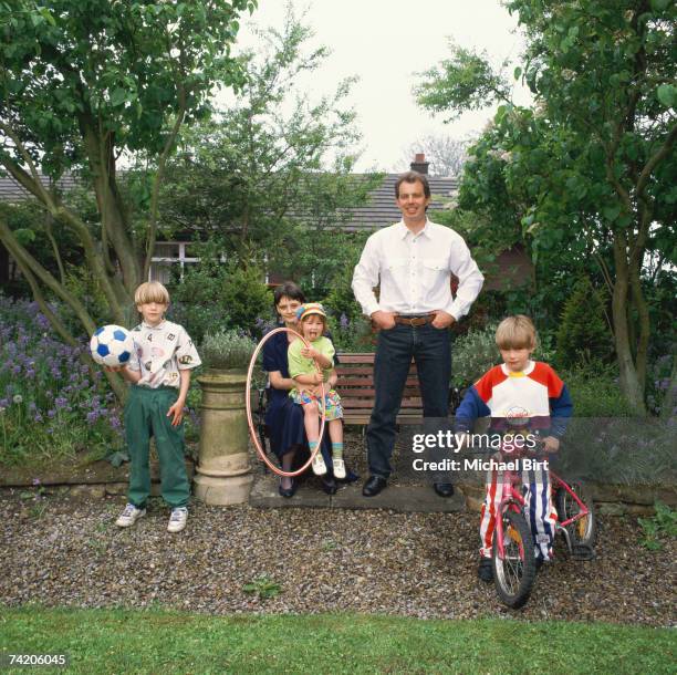 Labour MP Tony Blair, in the garden at his home in Myrobella, Trimdon Colliery Durham, with his wife Cherie and children, 1994.