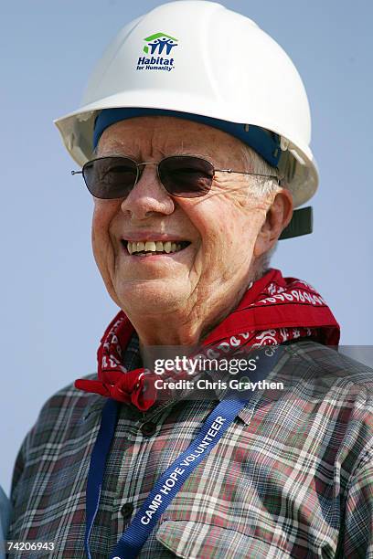 Former U.S. President Jimmy Carter works on the 1,000th home to be built by Habitat for Humanity on the Gulf Coast May 21, 2007 in Violet, Louisiana....