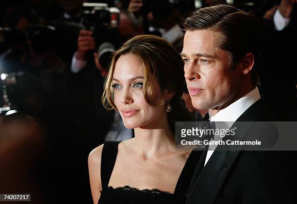 Actors Brad Pitt and Angelina Jolie attend the premiere for the film "A Mighty Heart" at the Palais des Festivals during the 60th International...