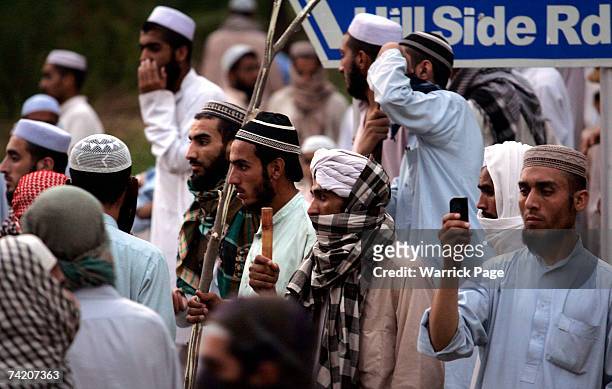 Islamic students of Jamia Faridia madrassa in Islamabad, block the road to their mosque after taking 3 police hostages in response to alleged police...