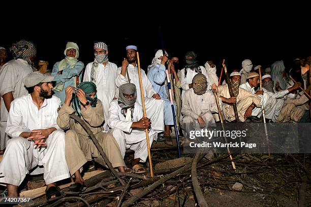 Islamic students of Jamia Faridia madrassa in Islamabad, block the road to their mosque after taking 3 police hostages in response to alleged police...