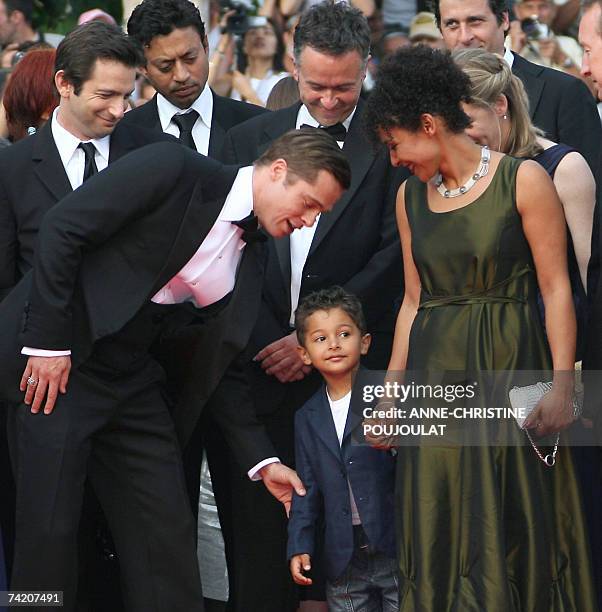 Actor and producer Brad Pitt talks 21 May 2007 to Adam Pearl, son of murdered journalist Daniel Pearl, next to French journalist and writer Mariane...