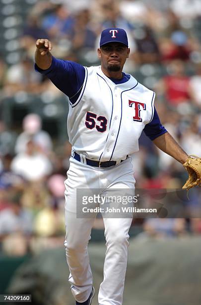 Joaquin Benoit of the Texas Rangers throws to first during the game against the Toronto Blue Jays at Rangers Ballpark in Arlington in Arlington,...