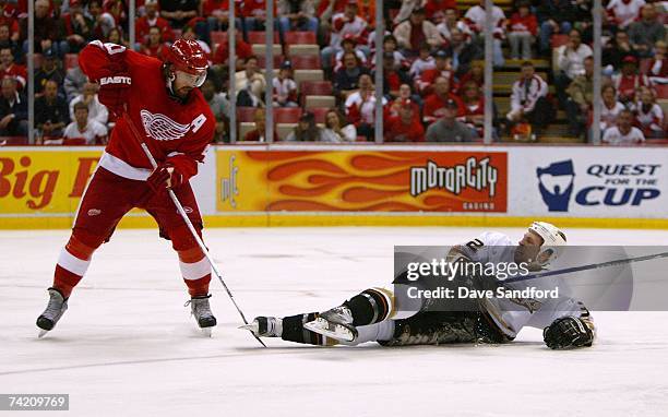 Henrik Zetterberg of the Detroit Red Wings gets see stick stuck in the skate of Travis Moen of the Anaheim Ducks in game five of the 2007 Western...