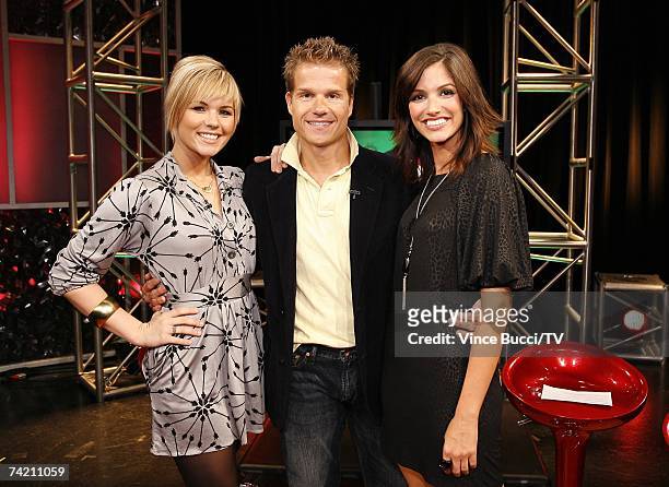 Dancer-choreographer Louis Van Amstel poses with show host Kimberly Caldwell and guest host Kristin Hope on the set of "Reality Chat" at the TV Guide...