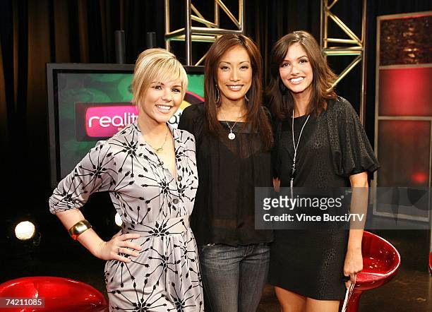 Actress Carrie Ann Inaba poses with show host Kimberly Caldwell and guest host Kristin Hope on the set of "Reality Chat" at the TV Guide Channel...