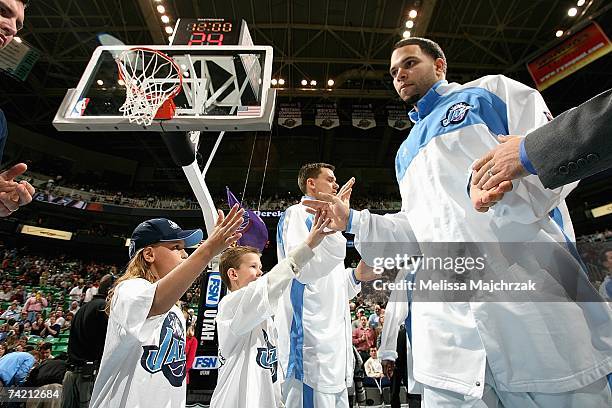 Deron Williams of the Utah Jazz gets high fives during team introductions prior to the NBA game against the Portland Trailblazers at EnergySolutions...