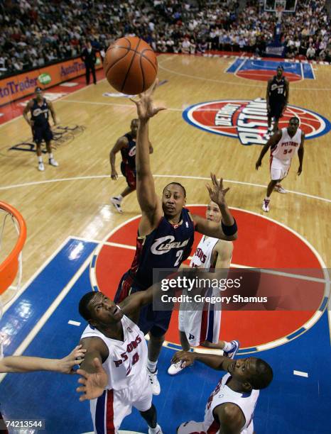 Donyell Marshall of the Cleveland Cavaliers attempts a shot against Antonio McDyess, Lindsey Hunter and Tayshaun Prince of the Detroit Pistons in...