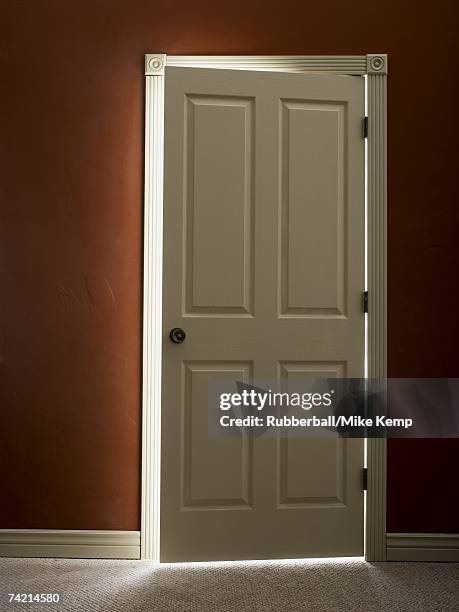 door slightly ajar with light - door ajar stock pictures, royalty-free photos & images