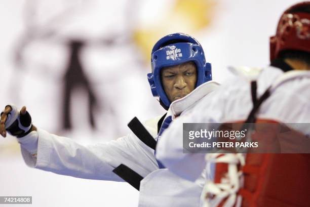 Daba Modibo Keita of Mali clashes with Nam Yun-bae of South Korea in the Male Heavyweight semi-final in the World Taekwondo Championship in Beijing...