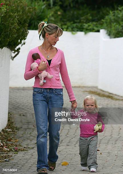 Kate McCann, the mother of missing girl Madeleine, holds her daughter Amelie's hand while dropping her off at the nursery at the Ocean Club holiday...