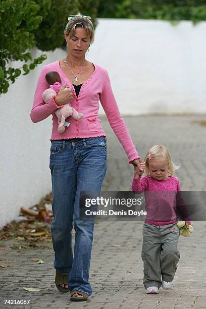 Kate McCann, the mother of missing girl Madeleine, holds her daughter Amelie's hand while dropping her off at the nursery at the Ocean Club holiday...