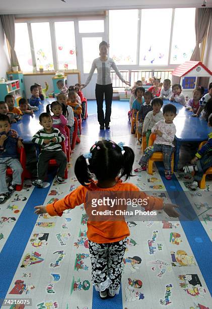 Young girl performs on a class in a kindergarten on May 21, 2007 in Zibo of Shandong Province, China. The Ministry of Education in March released the...