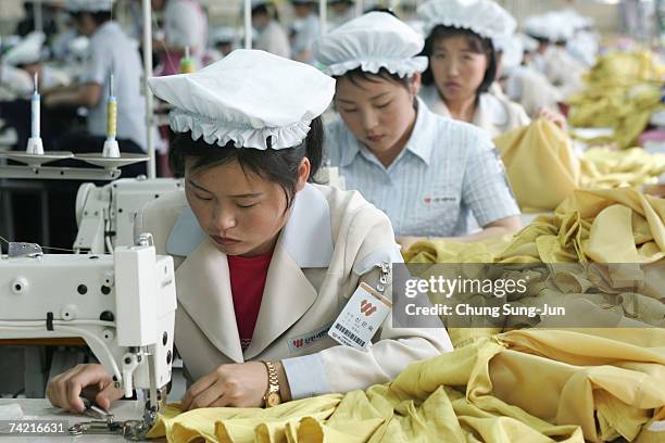 North Korean women work at the assembly line of the factory of South Korean textile company ShinWon at the Kaesong industrial complex on May 22, 2007...
