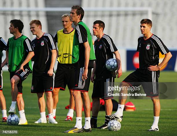 Harry Kewell, John Arne Riise, Sami Hyypia, Peter Crouch, Jamie Carragher and Steven Gerrard look on during the Liverpool training session prior to...