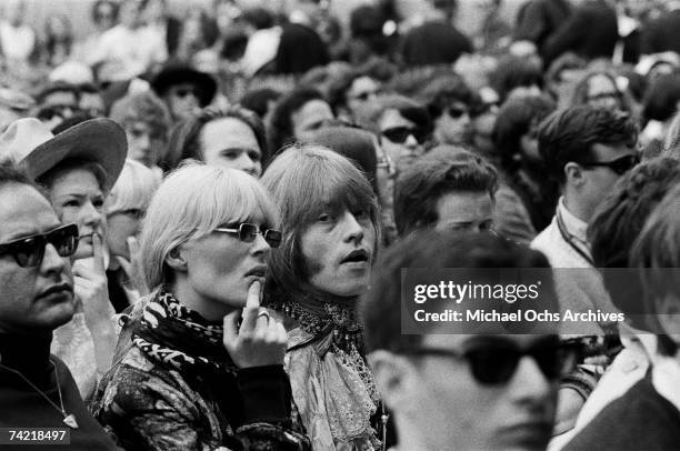 Brian Jones of The Rolling Stones and Nico in the audience at the Monterey Pop Festival on June 18 1967 in Monterey, California.