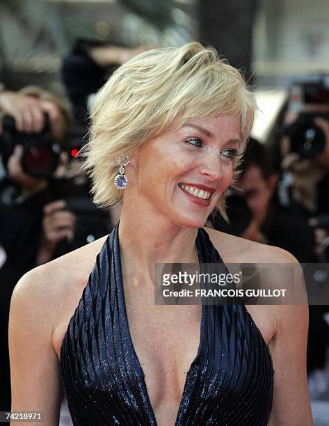 Actress Sharon Stone smiles 22 May 2007 as she poses upon arriving at the Festival Palace in Cannes, southern France, for the screening of US...