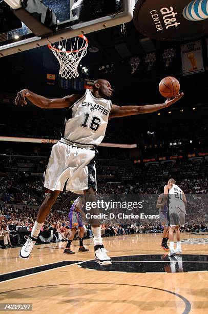 Francisco Elson of the San Antonio Spurs reaches for a rebound in Game Six of the Western Conference Semifinals against the Phoenix Suns during the...