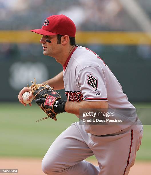 Conor Jackson of the Arizona Diamondbacks fields against the Colorado Rockies at Coors Field on May 17, 2007 in Denver, Colorado. The Diamondbacks...