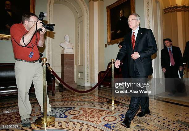 Senate Majority Leader Harry Reid walks towards the podium to brief reporters after the weekly Democratic policy luncheon at the Capitol May 22, 2007...