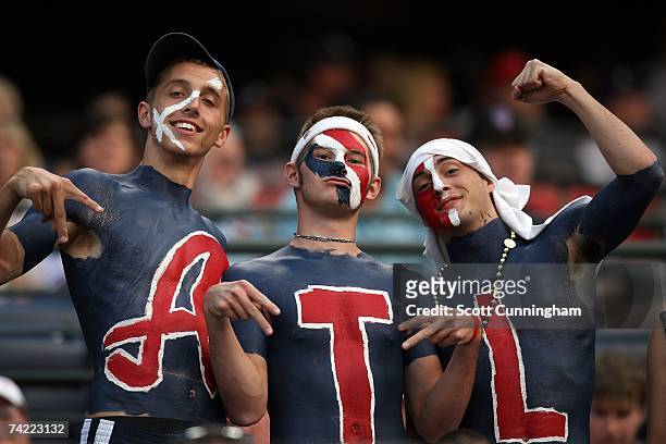 Fans of the Atlanta Braves pose during the game against the New York Mets at Turner Field on May 22, 2007 in Atlanta, Georgia. The Braves defeated...