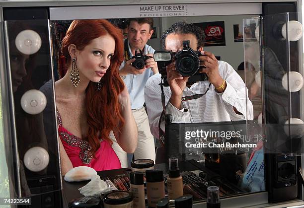 Actress Phoebe Price models Christophe Guillarme's 2007 collection between interviews for Fashion TV, MTV and Gala Magazine at designer Christophe...