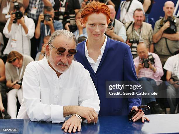 Director Bela Tarr and actress Tilda Swinton attend a photocall promoting the film 'The Man from London' at the Palais des Festivals during the 60th...