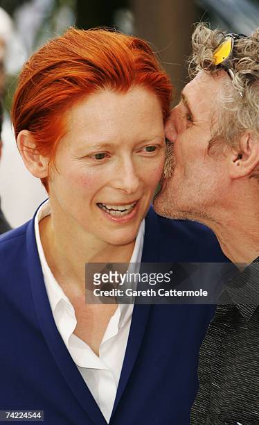 Actors Tilda Swinton and Miroslav Krobot attend a photocall promoting the film 'The Man from London' at the Palais des Festivals during the 60th...