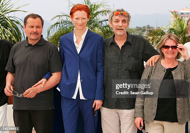 Unidentified guest, actors Tilda Swinton, Miroslav Krobot and unidentified guest attend a photocall promoting the film 'The Man from London' at the...