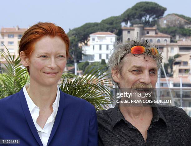 British actress Tilda Swinton and Hungarian actor Janos Derzsi pose 23 May 2007 during a photocall for Hungarian director Bela Tarr's film 'The Man...