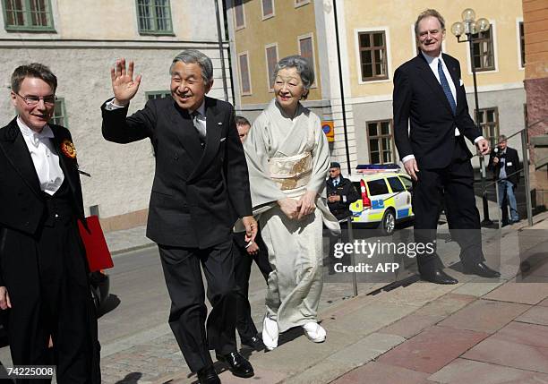 Japan's Emperor Akihito and Empress Michiko arrive with Upplands county Governor Anders Bjorck at Uppsala Cathedral for a memorial service for...