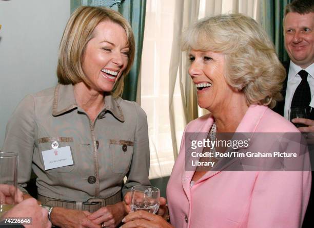 Camilla, Duchess of Cornwall laughs with Mary Nightingale at a reception for the Royal Television Society at Clarence House on May 22, 2007 in...