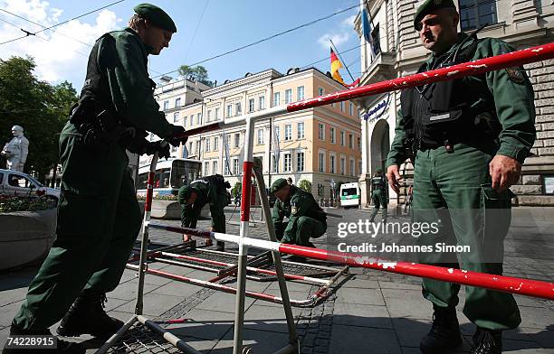 Policemen erect road blocks at Promenadeplatz Square on May 23 in Munich, Germany. The G8 justice and interior ministers meeting will take place at...